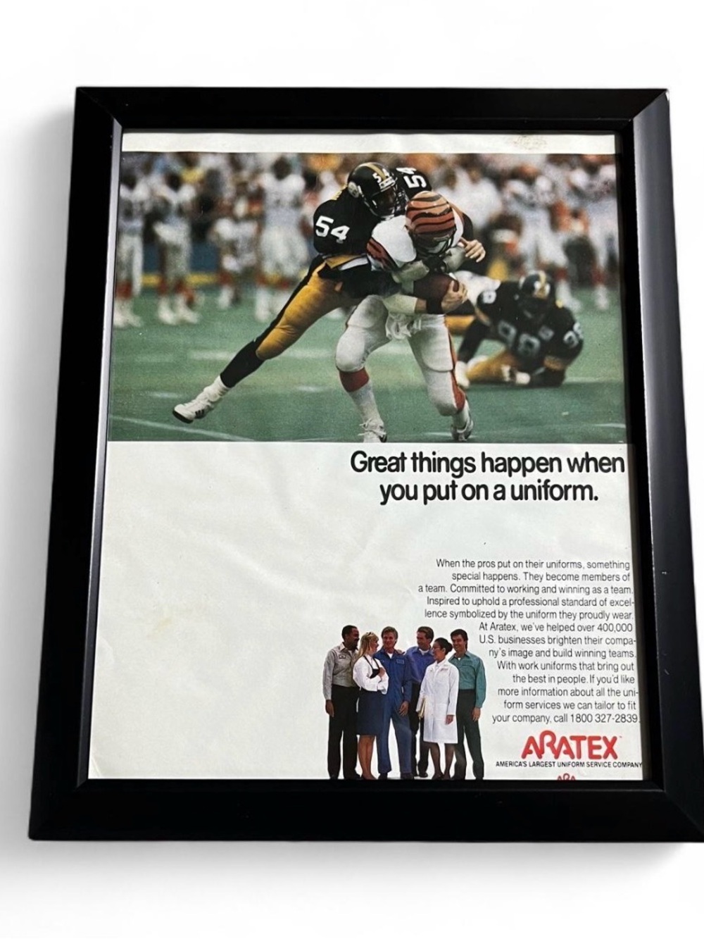 Vintage Black Framed Sports Print with Multi-Color Image